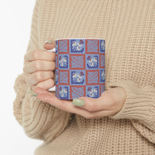 Stamped Elegance: Light Blue and Red Mug with White Flowers